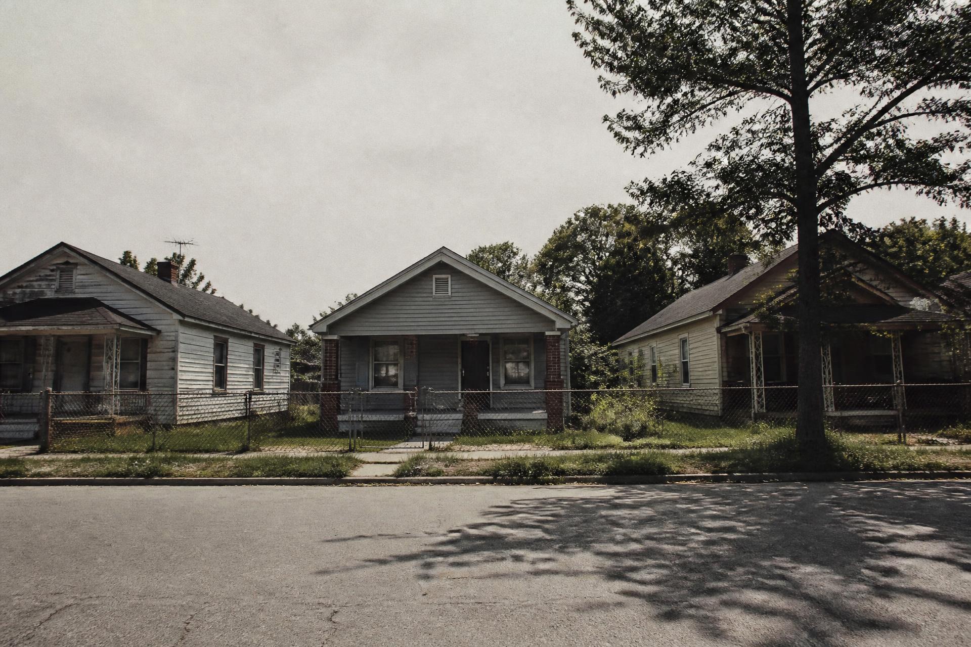 A quiet Detroit east-side street at midday. Something is not right about the light.
